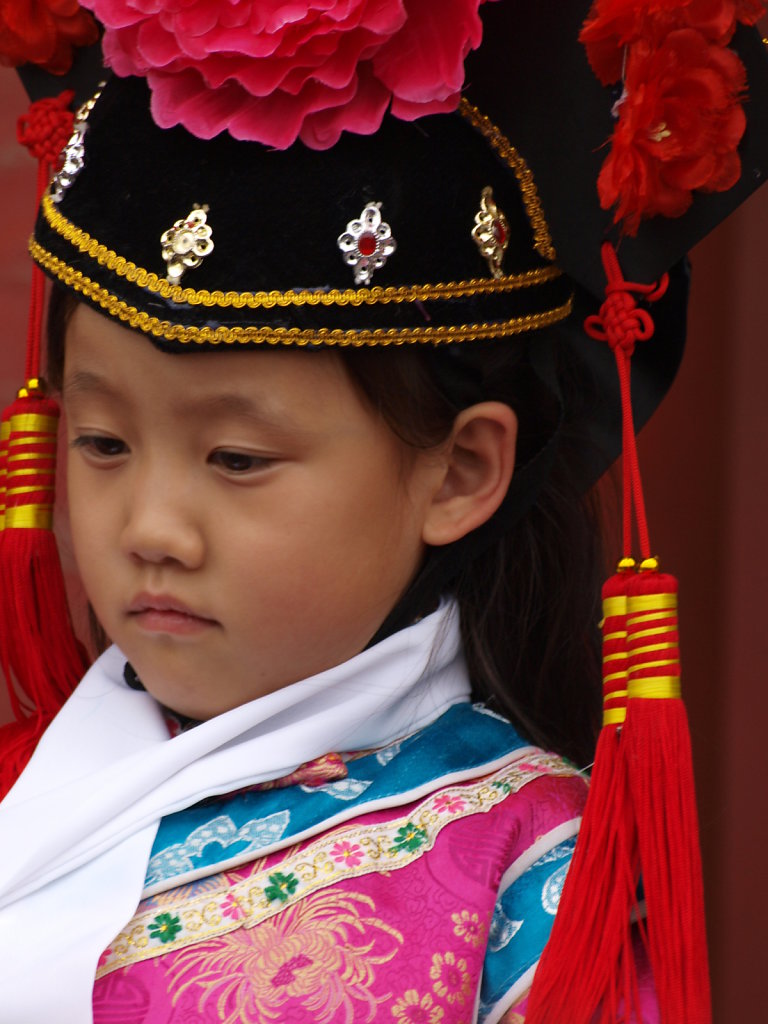 Little girl in costume as a tourist attraction